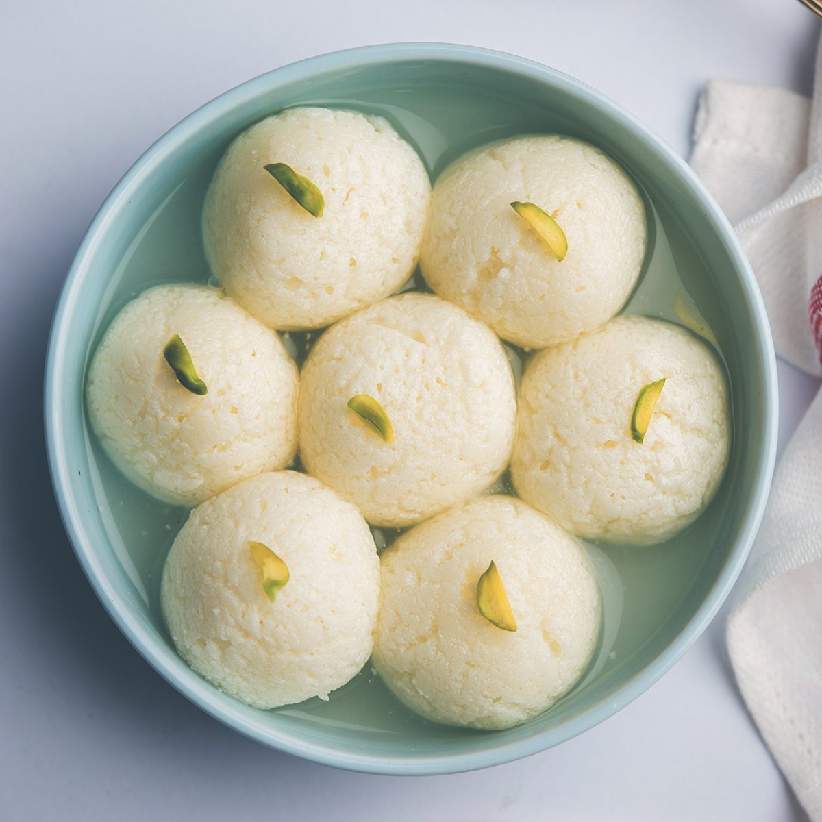 Indian Rasgulla or Rosogulla dessert/sweet served in a bowl. selective focus