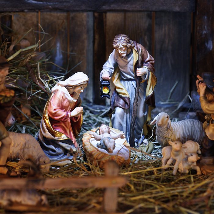 nativity scene with hand-colored figures made out of wood