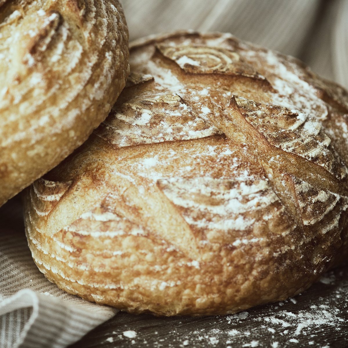 types of french bread Loafs Of Bread On Linen Cloth