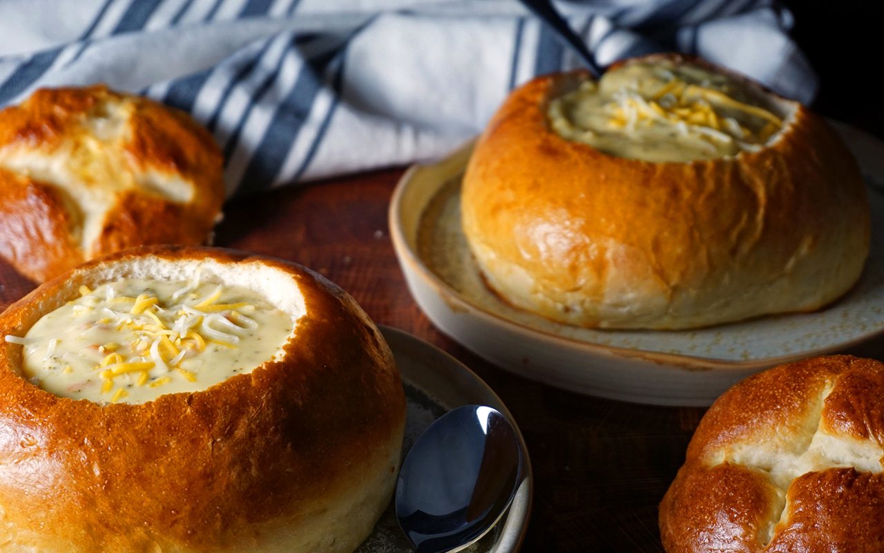 finished copycat panera bread bowls filled with cheddar broccoli soup - option 2 copycat panera bread bowl