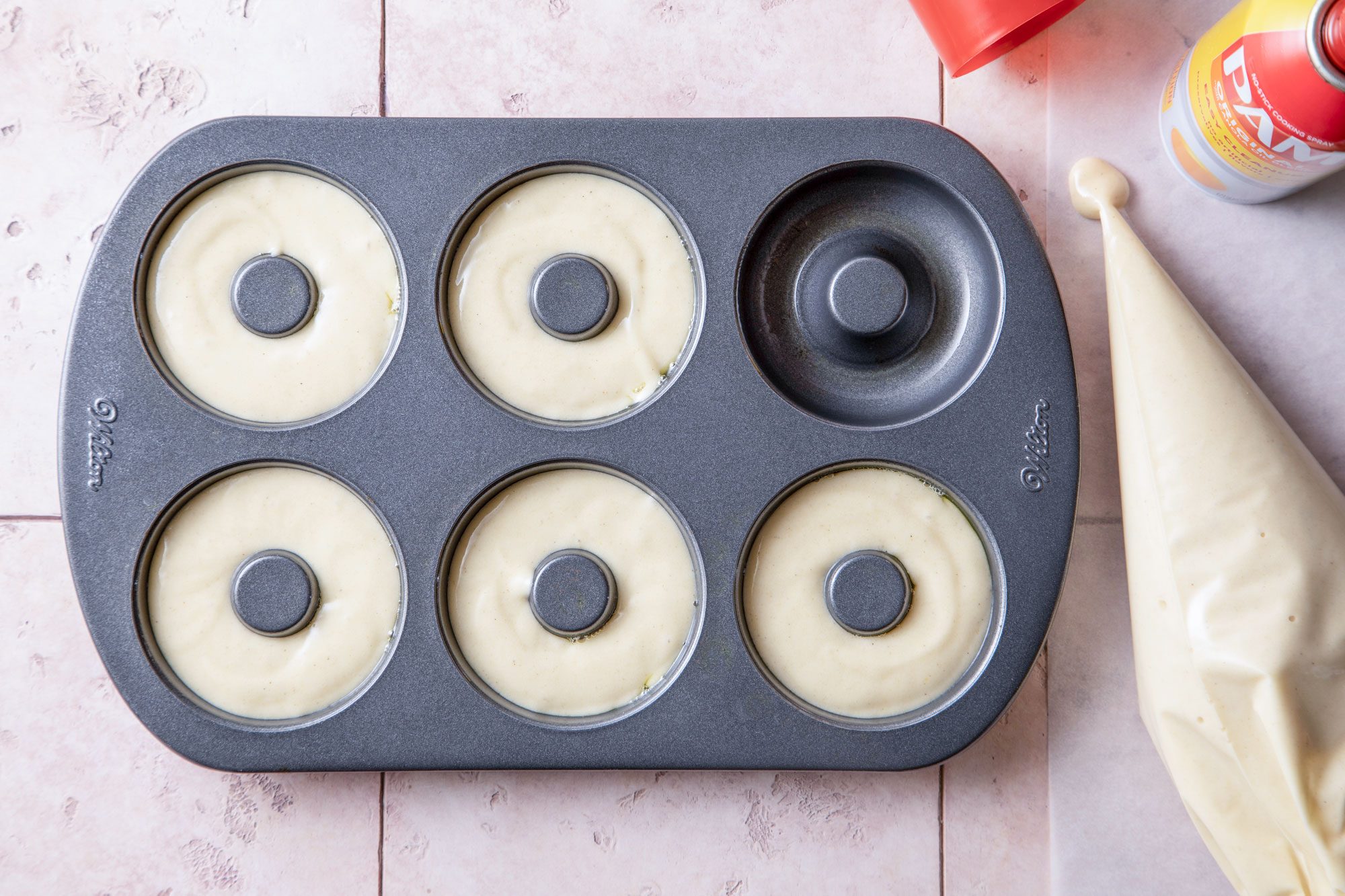 Pouring batter in mold for Gluten Free Doughnuts Rms 273906