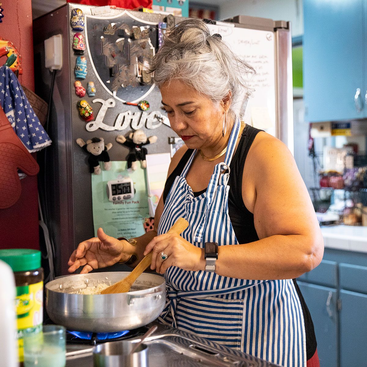 prediabetes foods to avoid Hispanic Woman Making Dinner In Kitchen 1069791240 1