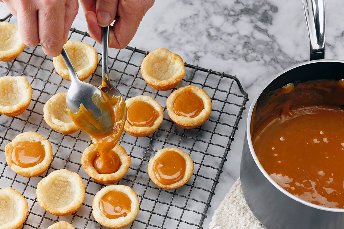 Step 5; Using Two Spoons To Fill Cup