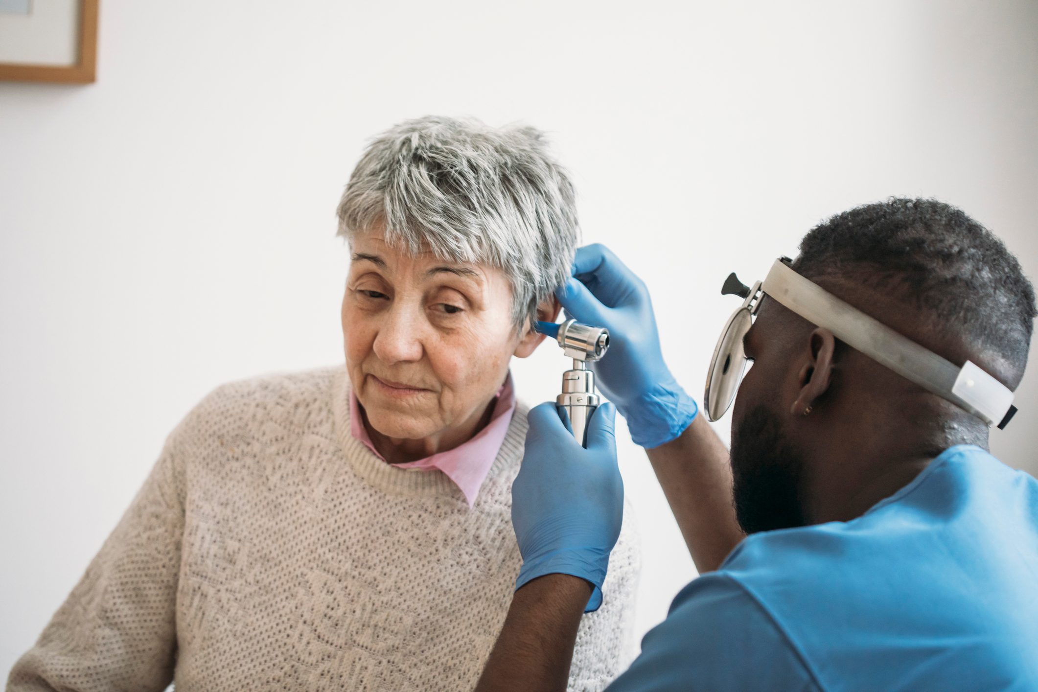 An Older Woman Having Her Ears Checked By The Ear Doctor