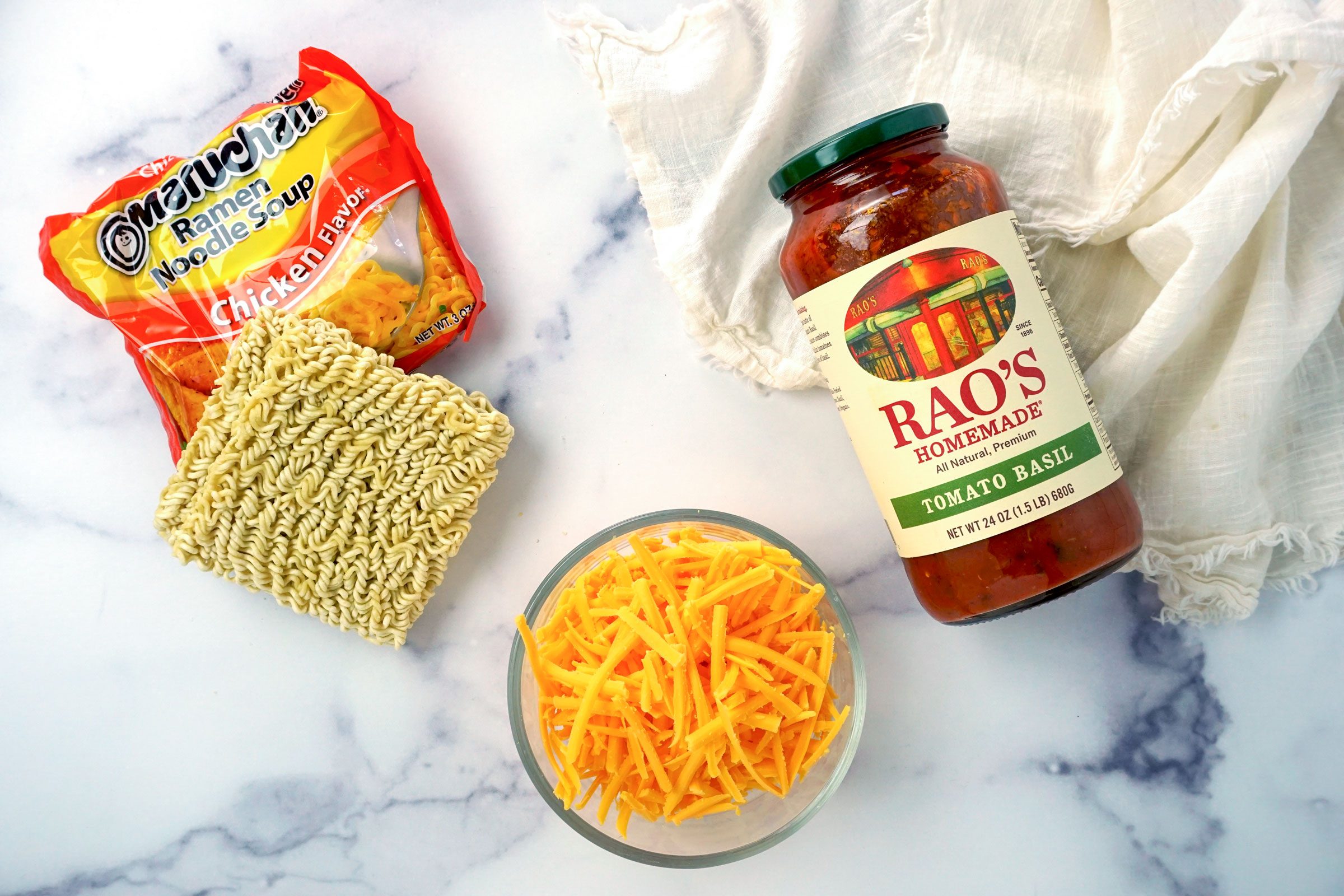 Tik Tok Ramen Lasagna ingredients on a marble surface