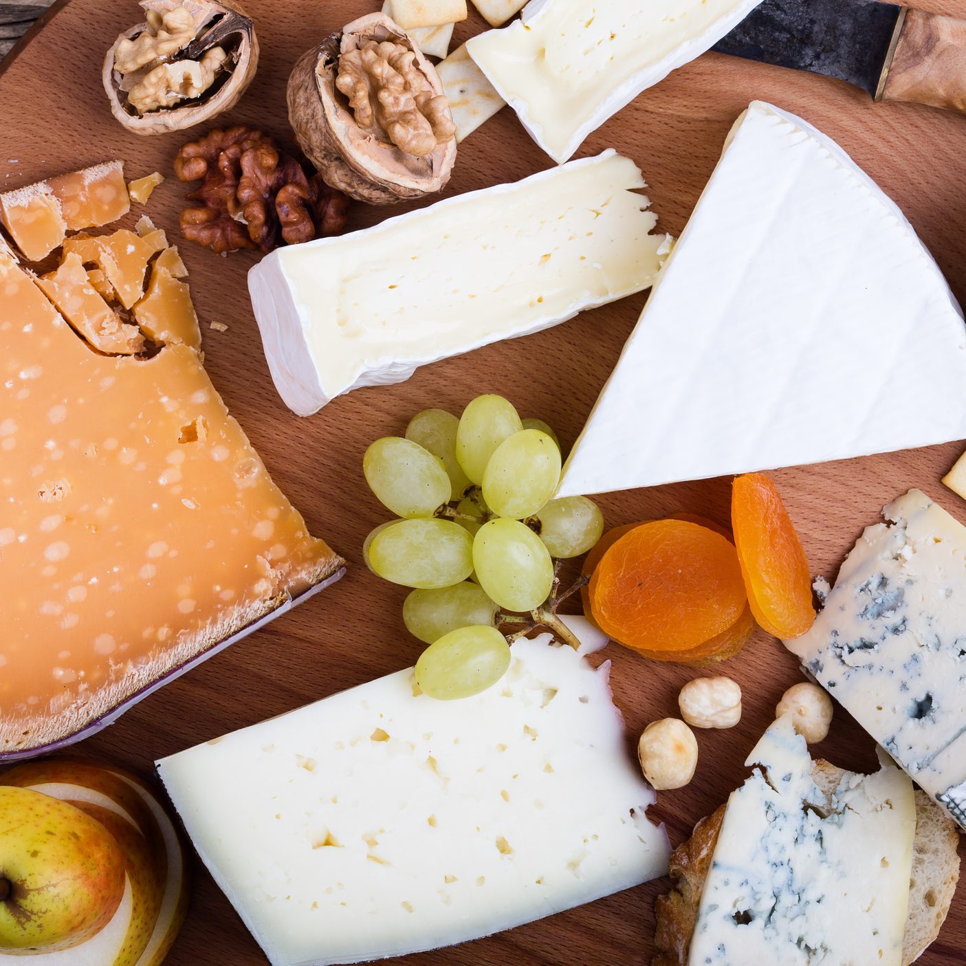 Cheese platter with fruits and wine