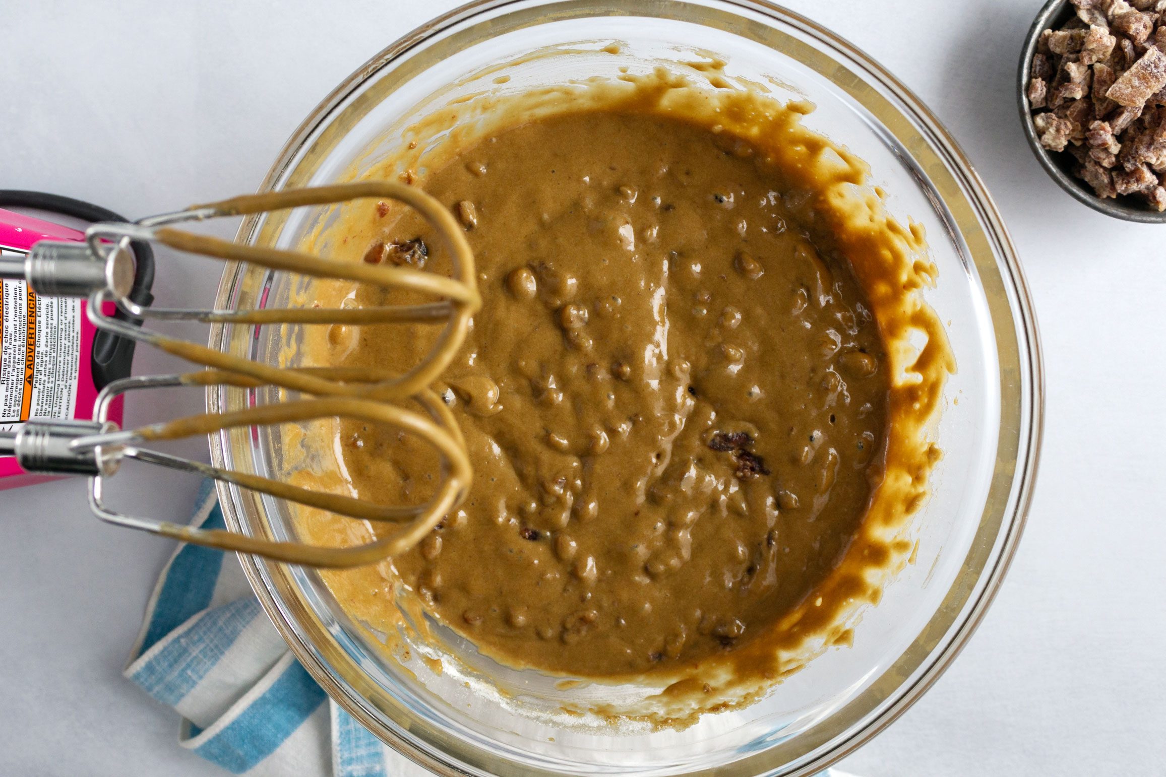 process shot of mixing sugars and eggs for Lemon Frosted Fruit Bars