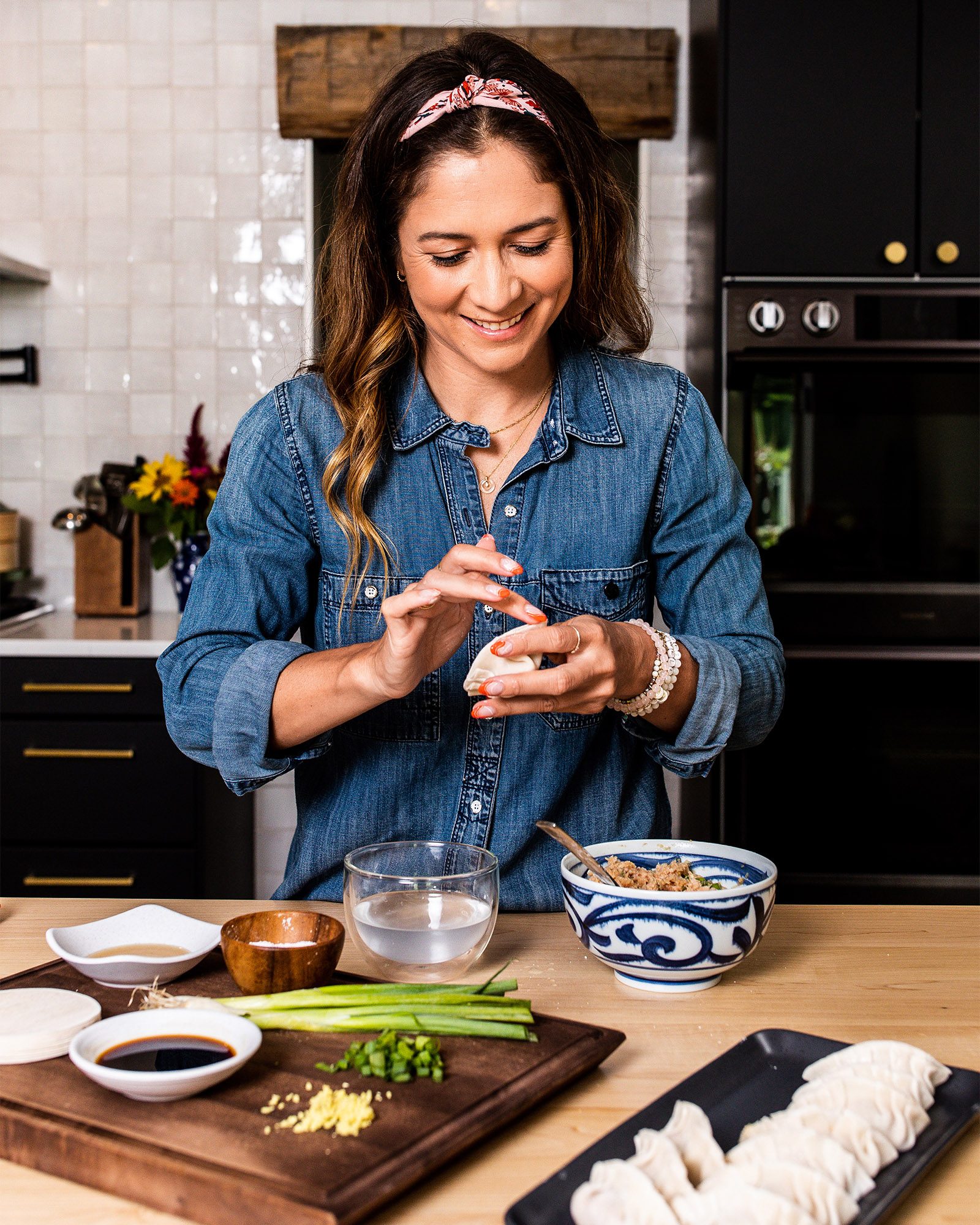 Peloton instructor Emma Lovewell assembling dumplings in her kitchen