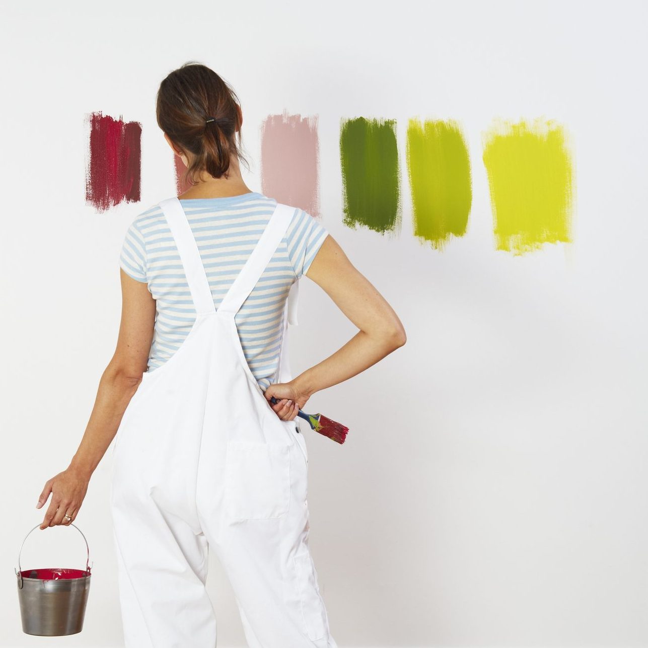 Woman looking at colour swatches on wall