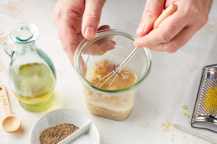 Mixing Liquid Ingredients in a Small Glass Utensil to make Caprese Pasta Salad