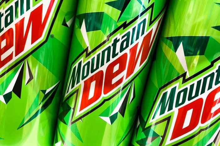 three mountain dew cans close up