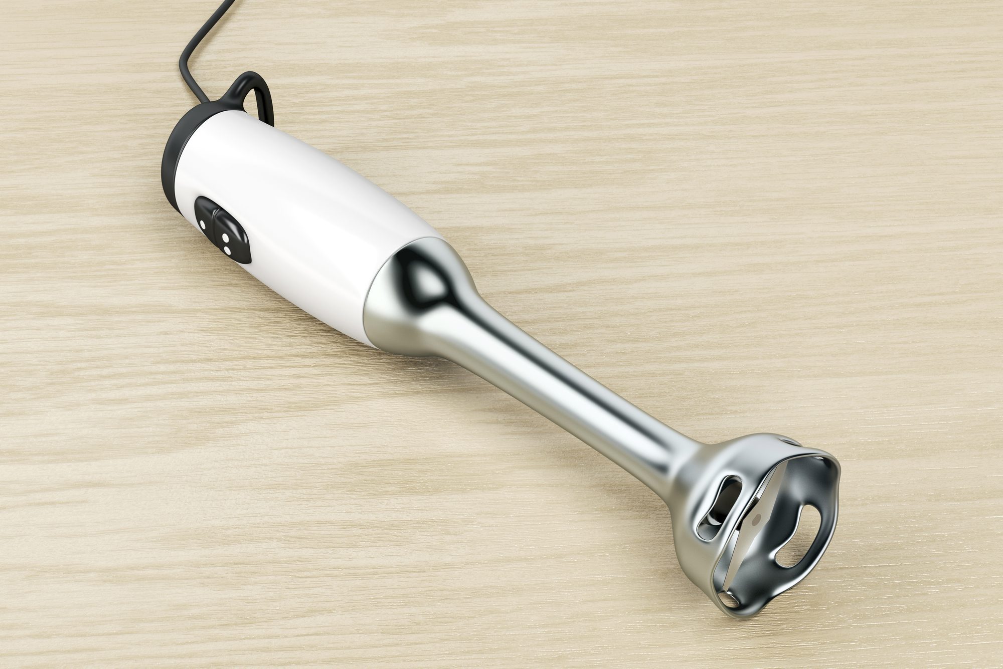 Hand blender on wood background