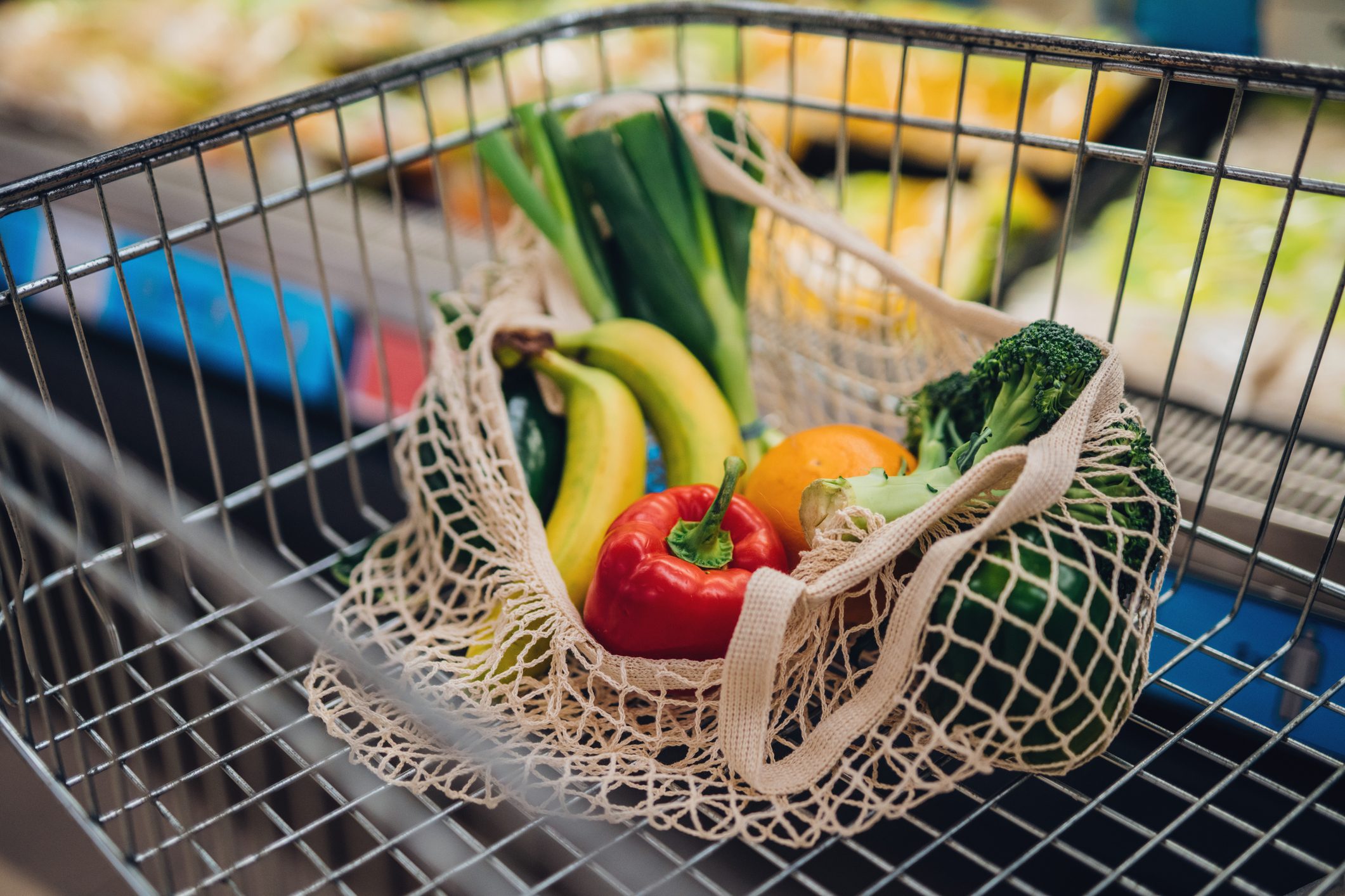 Grocery Shopping With Reusable Shopping Bag At Supermarket