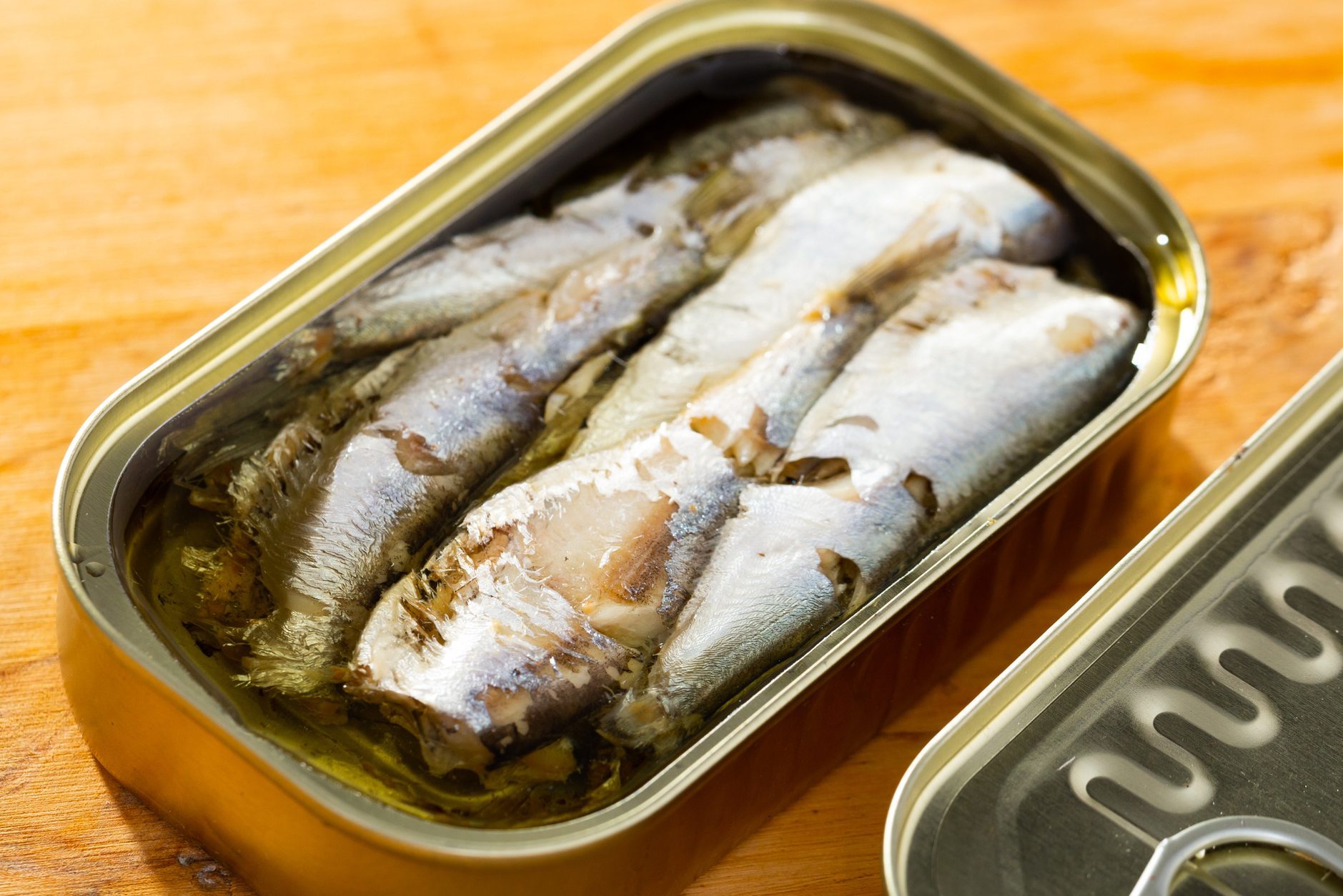 Tin can with smoked sprats, sardines, closeup
