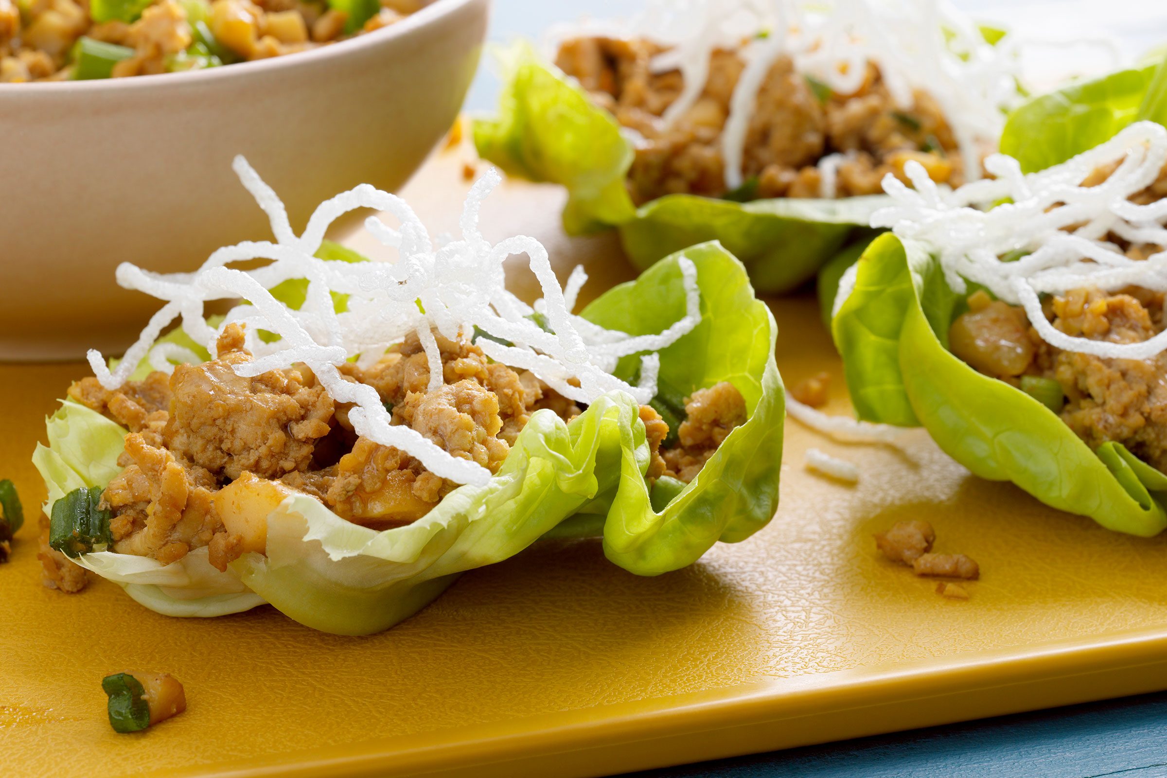 Platter Of Finished Lettuce Wraps, Lettuce Leaves And Bowls Of Toppings.