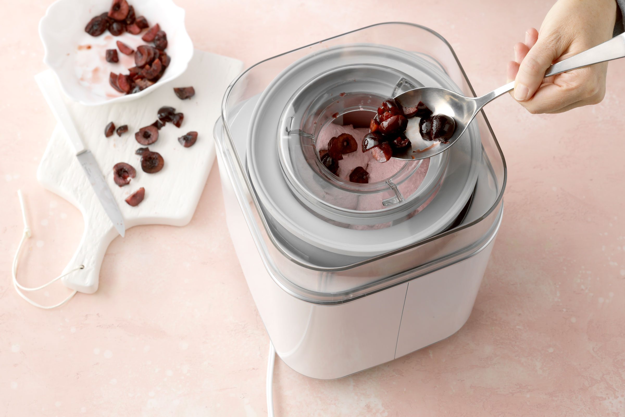 making cherry ice cream in an ice cream maker