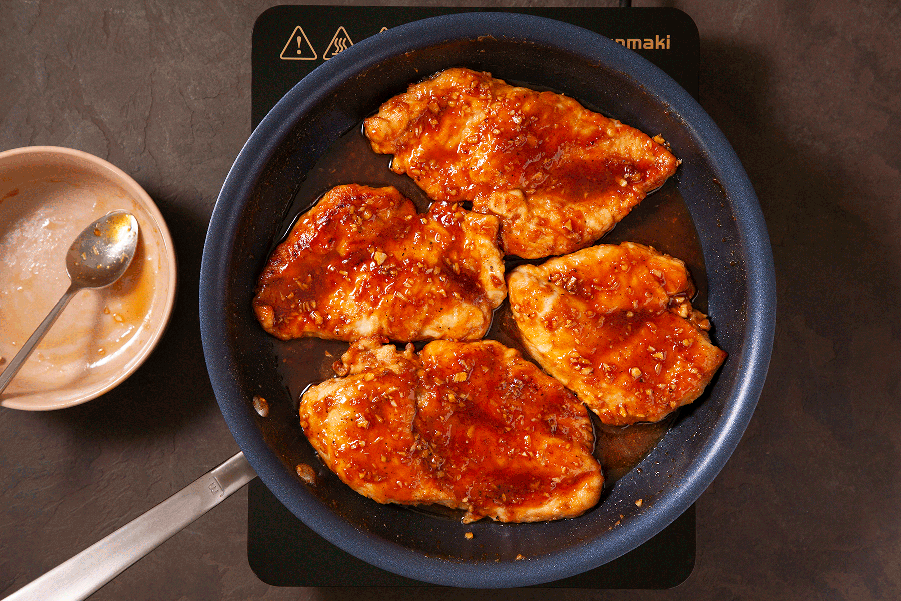 Honey Garlic Chicken cooking in a skillet