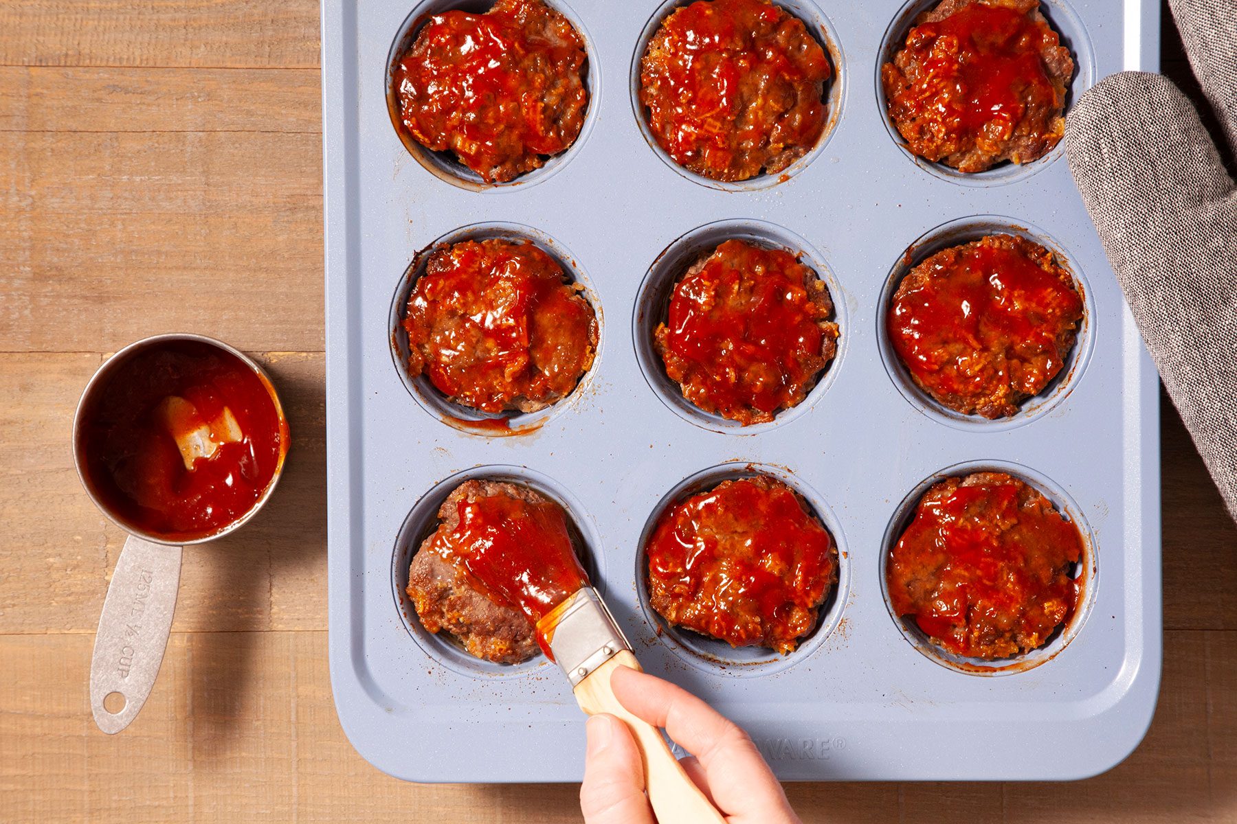 Brushing Sauce on Meat loaves