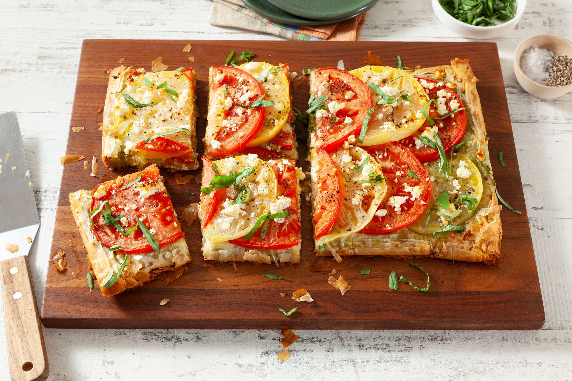 Tomato Tart sliced on chopping board