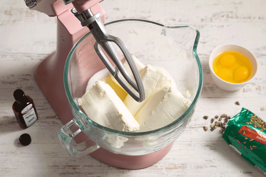 Whisking cream cheese, sugar and eggs