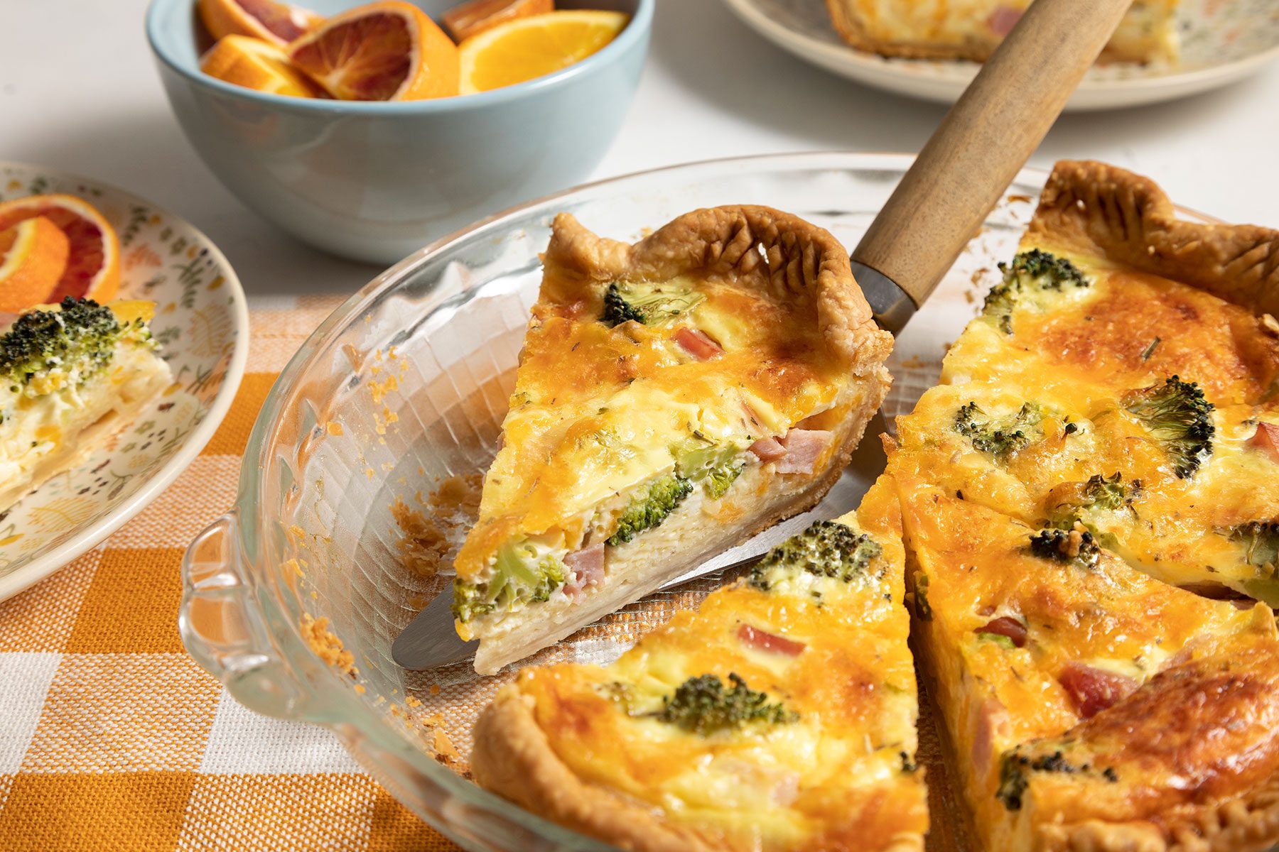 Picking slice of Ham And Broccoli Quiche