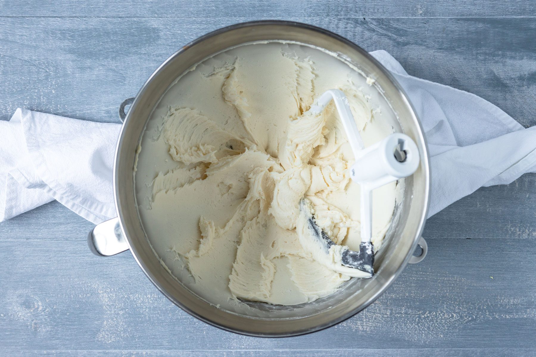 cheese and softened butter in the mixture bowl