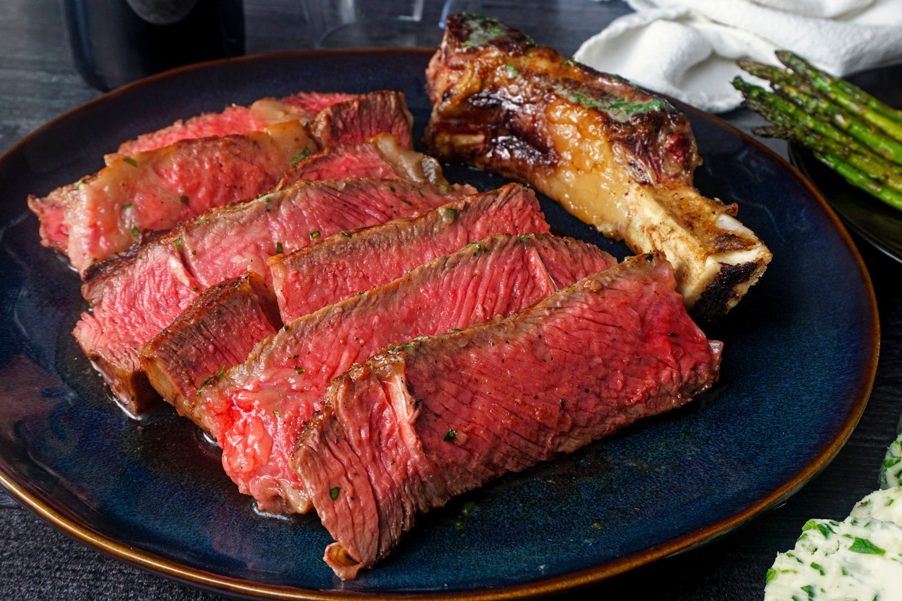 Cut out pieces of Pioneer Woman Cowboy Steak served in a plate