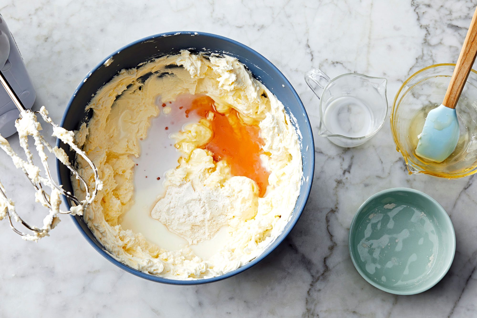 In a large bowl, use a stand mixer to beat the cream cheese and mascarpone cheese