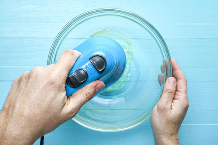 Whisking eggs whites with hand whisking machine