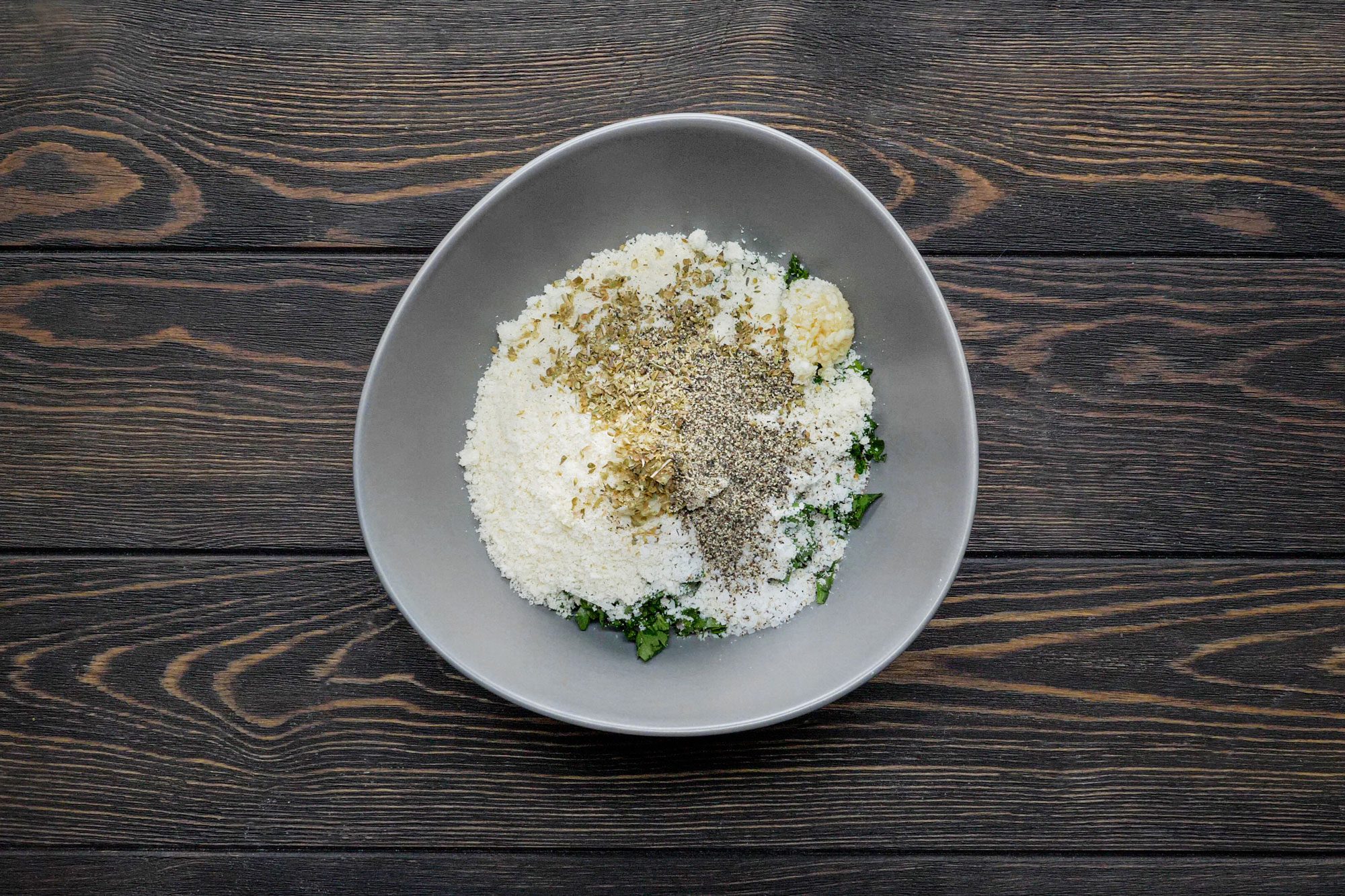 Combine bread crumbs, parsley, Parmesan cheese, garlic, oregano, salt and teaspoon pepper