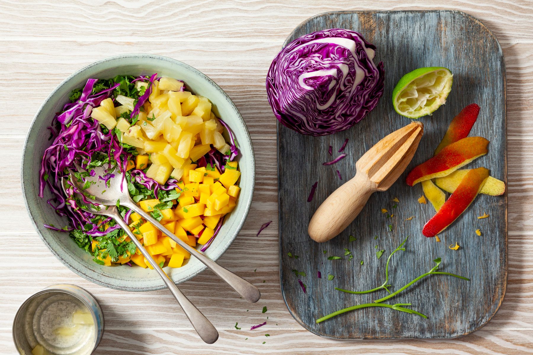 Cabbage, mango, pineapple and other fruits combined together on a bowl