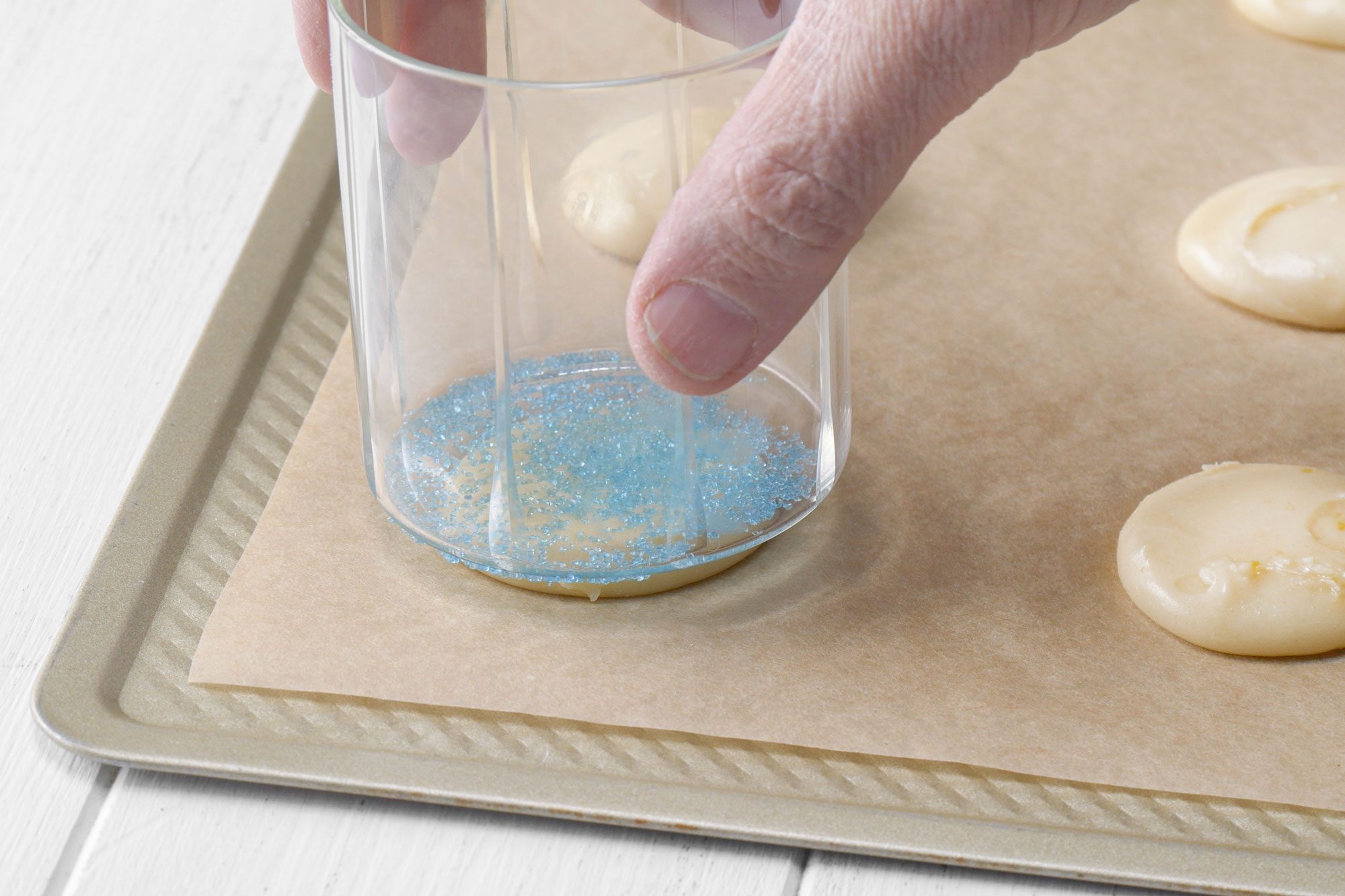 Flattening the dough with glass back side
