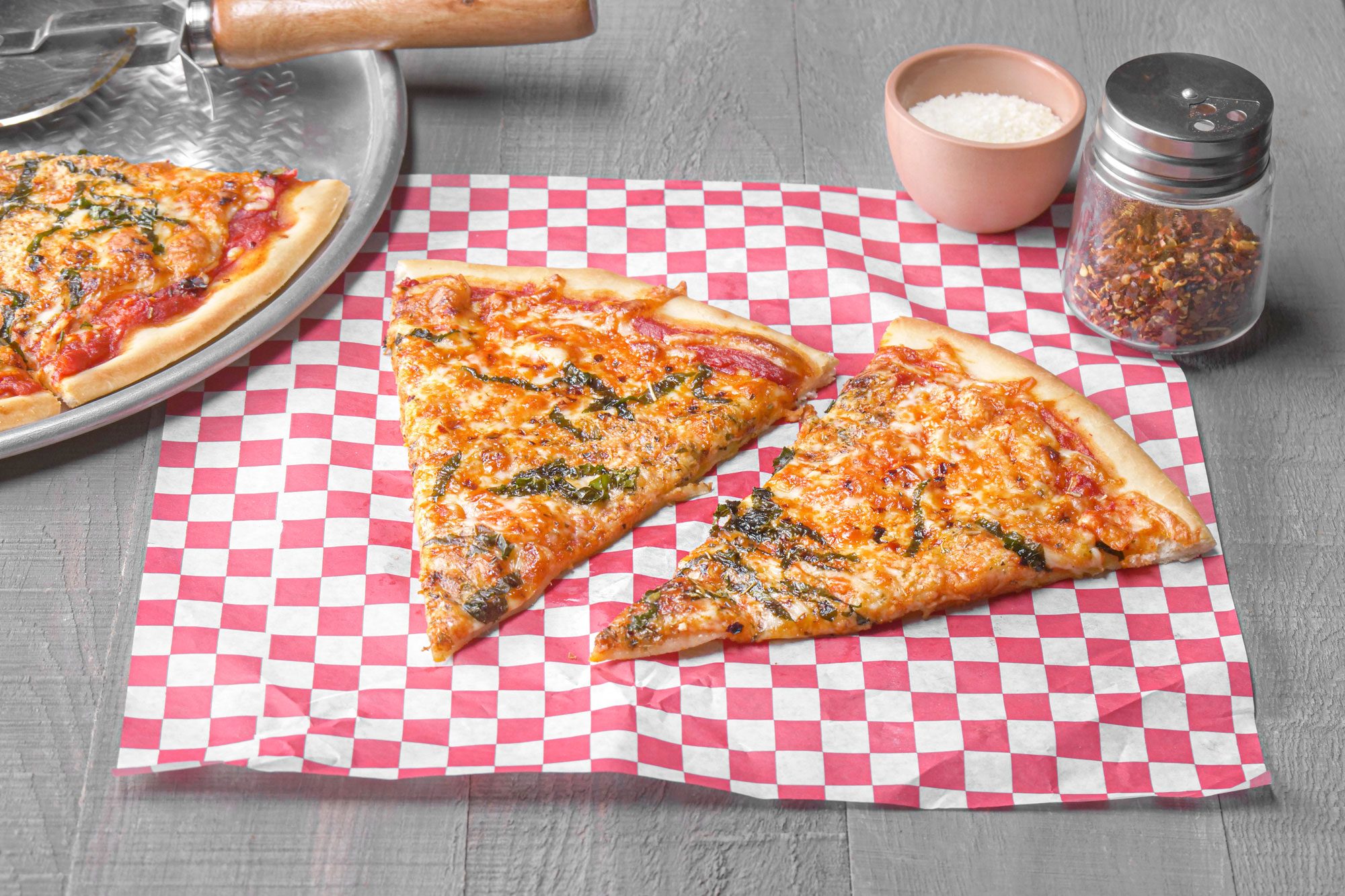 New York-Style pizza slices with crispy thin crust, melty cheese, and flavorful toppings