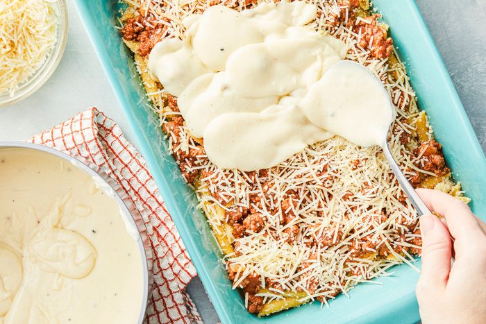 Pour bechamel sauce over beef mixture