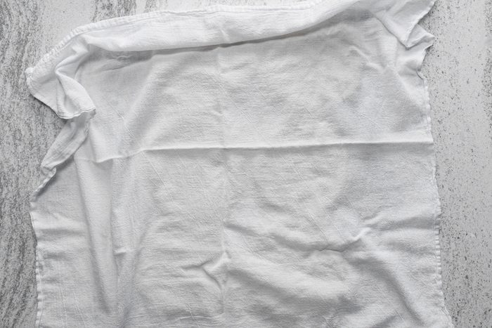 A piece of white cloth on a kitchen countetop