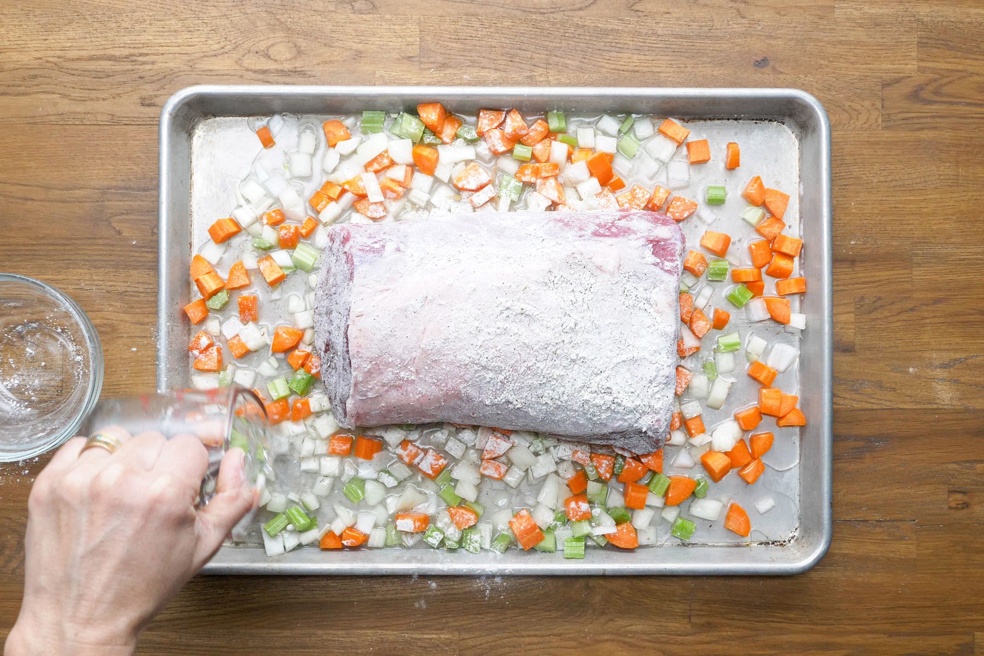 Add 2 cups water to pan over the roast