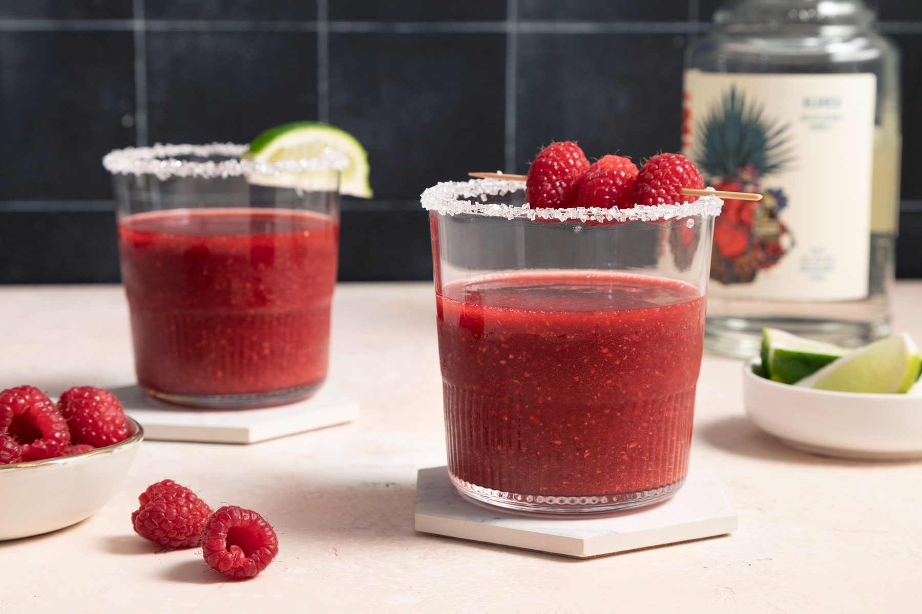 Raspberry Margarita glasses garnished with fruits
