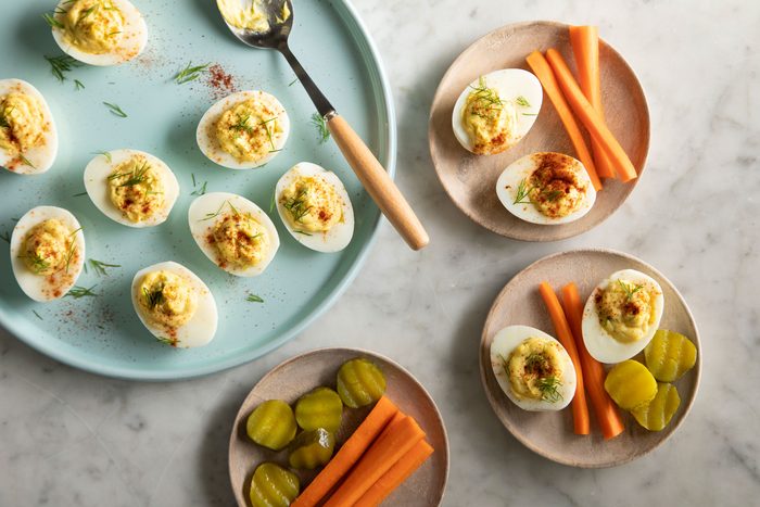 Southern Deviled Eggs served in plates with vegetables