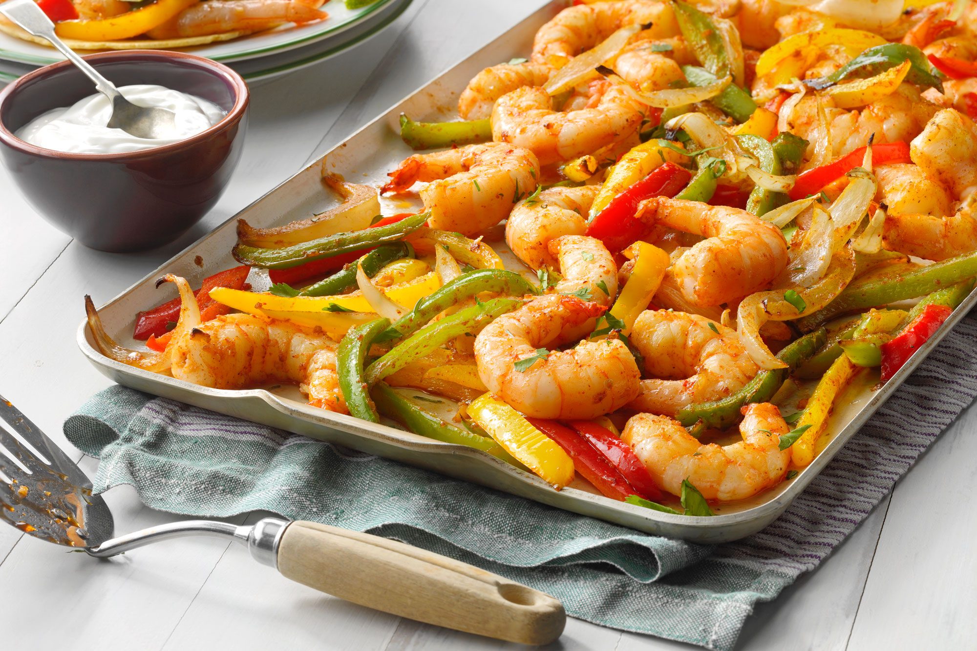 Tray of Sheet-Pan Shrimp Fajitas with succulent shrimp and colorful peppers