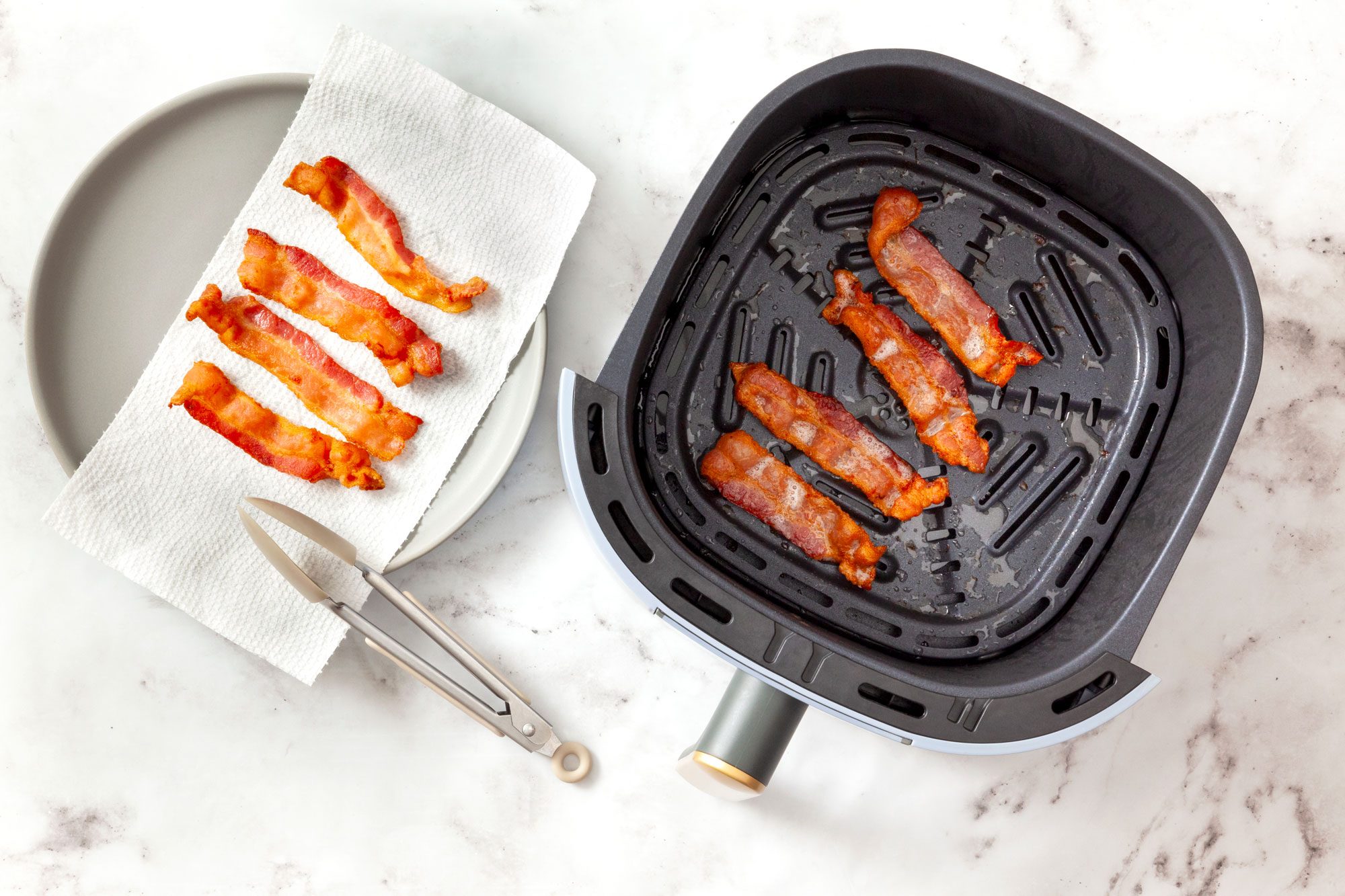 Transfer the bacon to a plate from air fryer after cooking