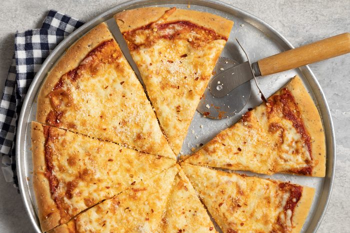 A cheese pizza on a tray