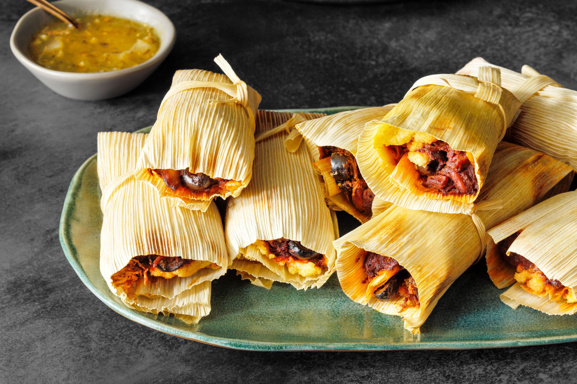 Chicken Tamales served on a green platter