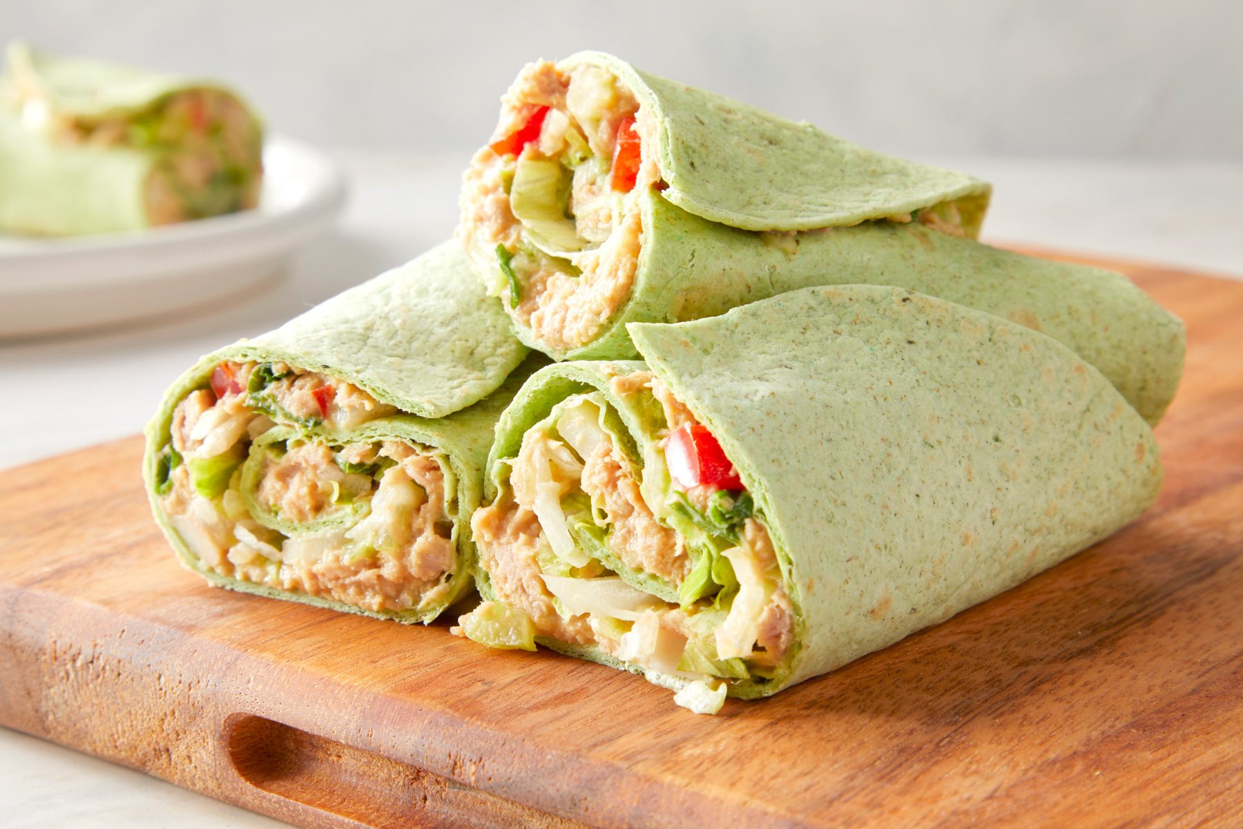 A group of Crunchy Tuna Wraps on a cutting board