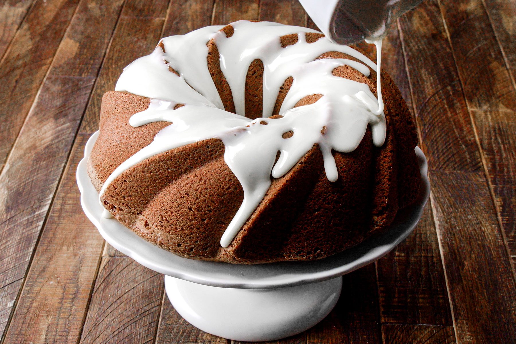 Drizzling Icing over Olive Oil Cake