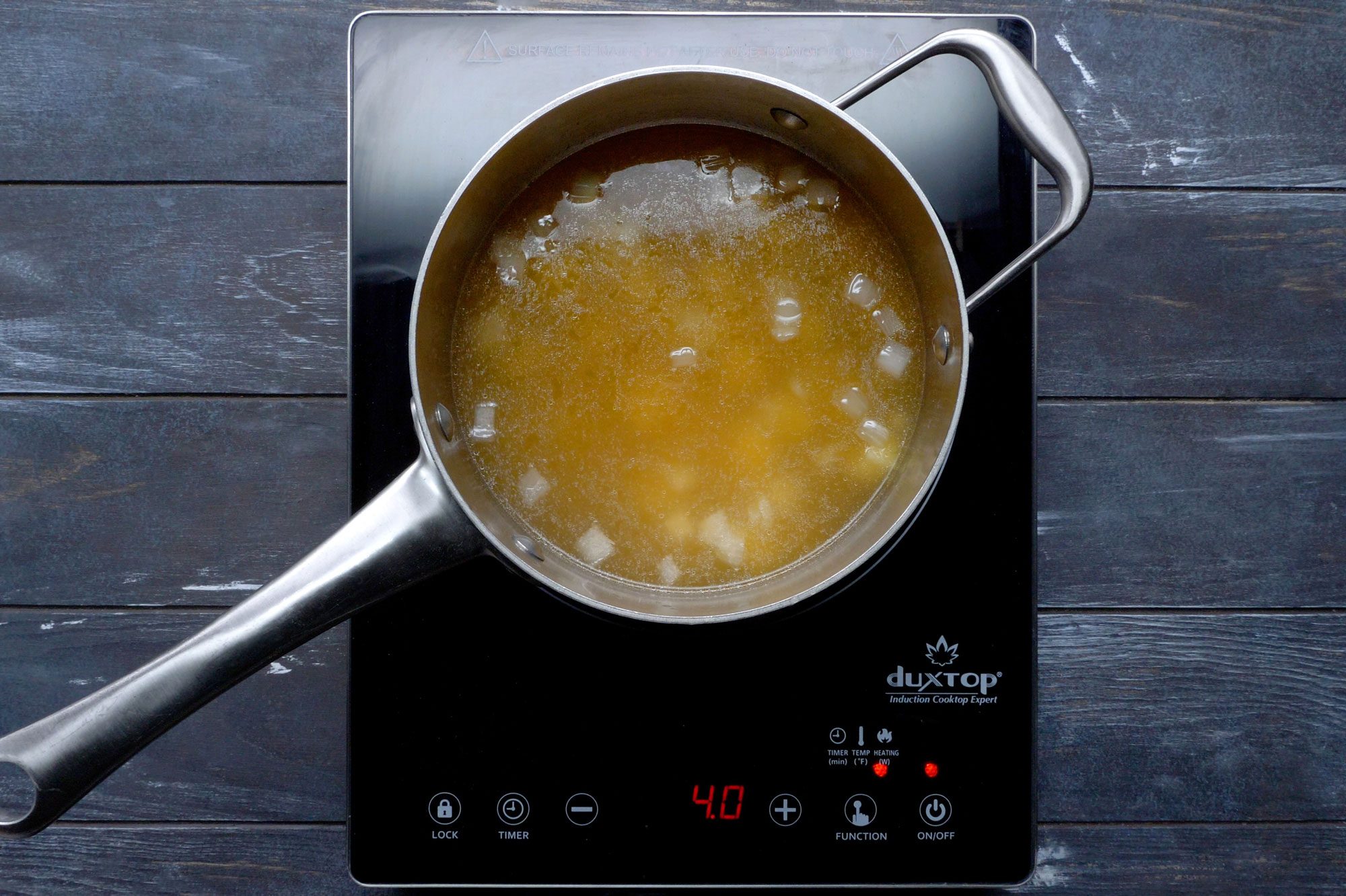 Add the broth and potatoes, then bring to a boil