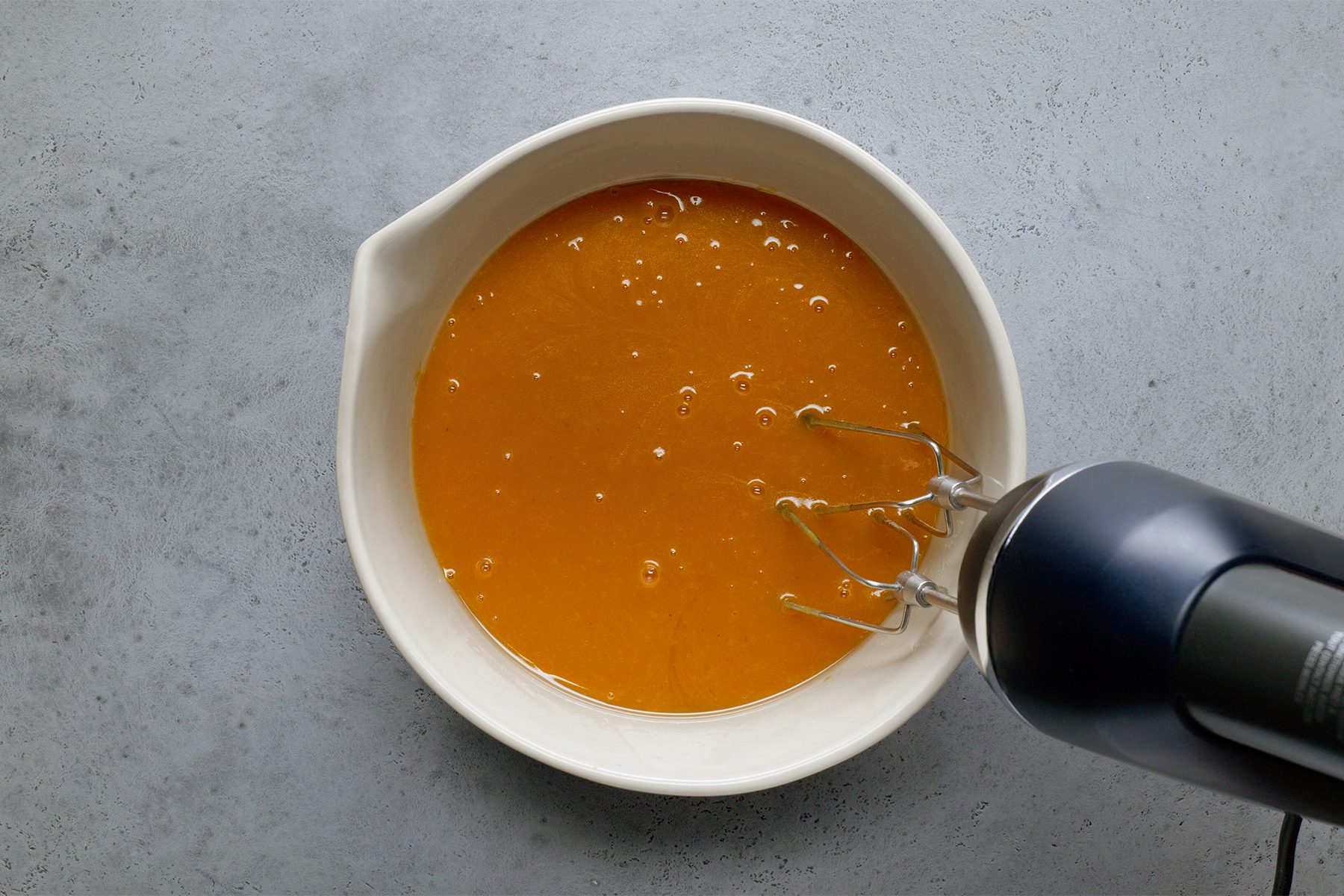 pumpkin, sugar, oil and eggs until well blended; in a large bowl; blending machine