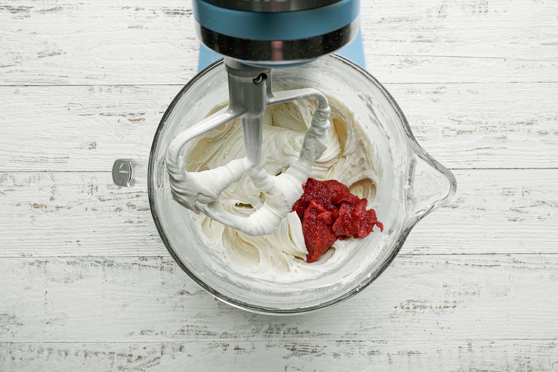 Beating eggs and strawberry extract