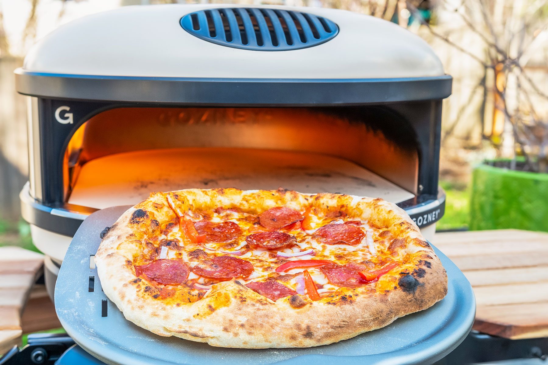 Peeling out Pizza from Gozney Arc Pizza Oven 