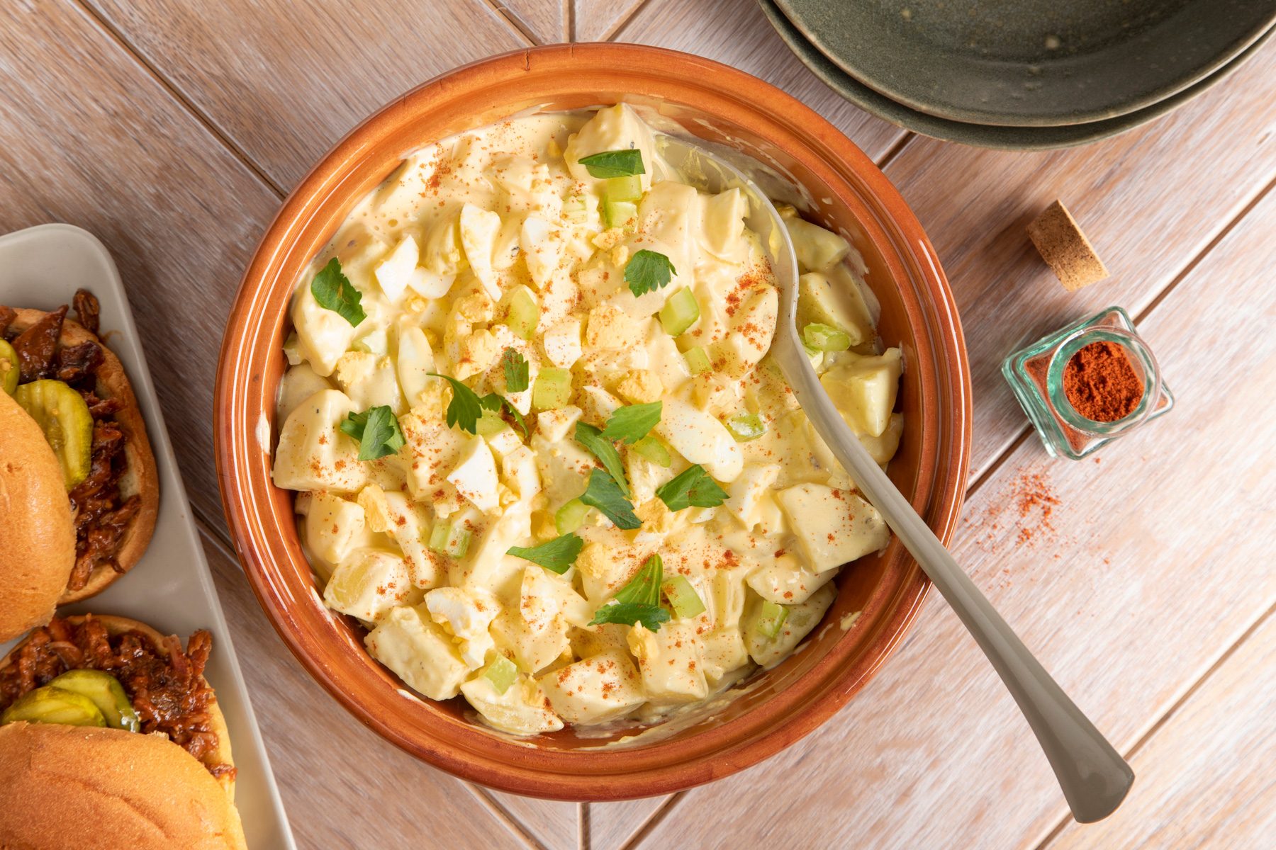A Bowl of Amish Potato Salad with a spoon
