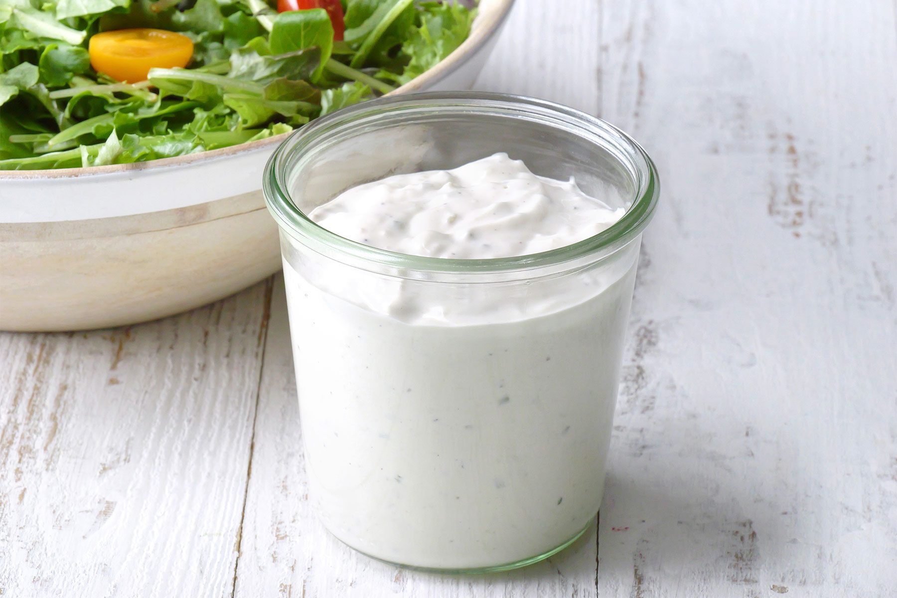 wide shot of buttermilk bluecheese dressing in a jar